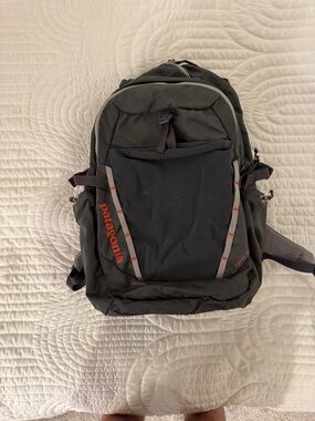Patagonia Black Backpack with Orange Logo Accents